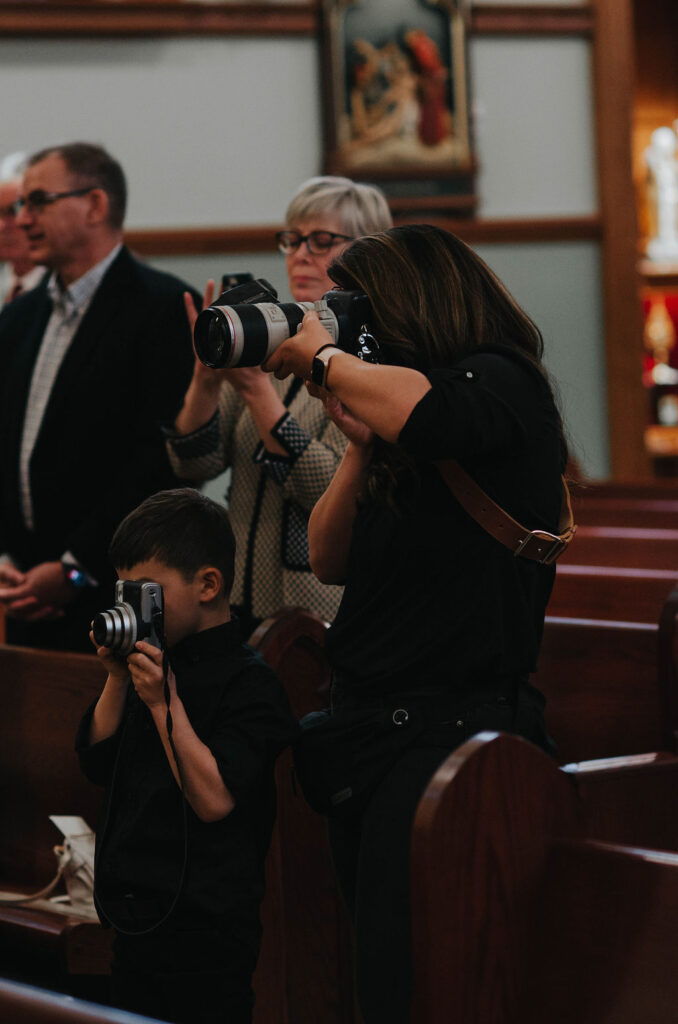 DC wedding photographer, Victoria V, photographing a wedding with her son