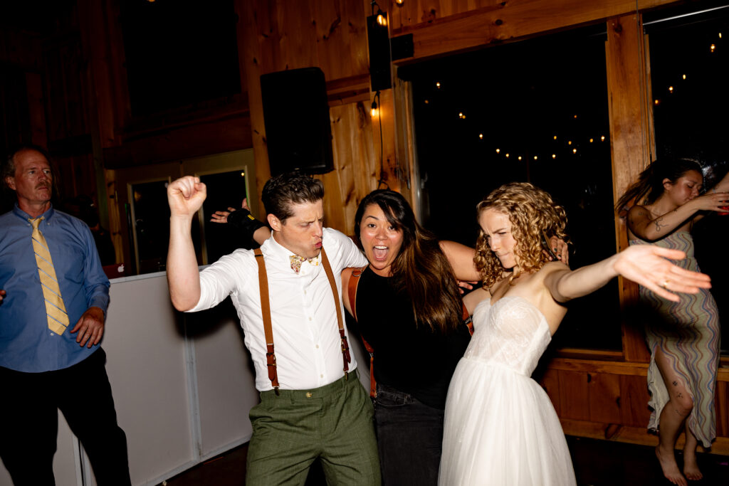 Victoria V celebrating with clients during their Shenandoah wedding reception