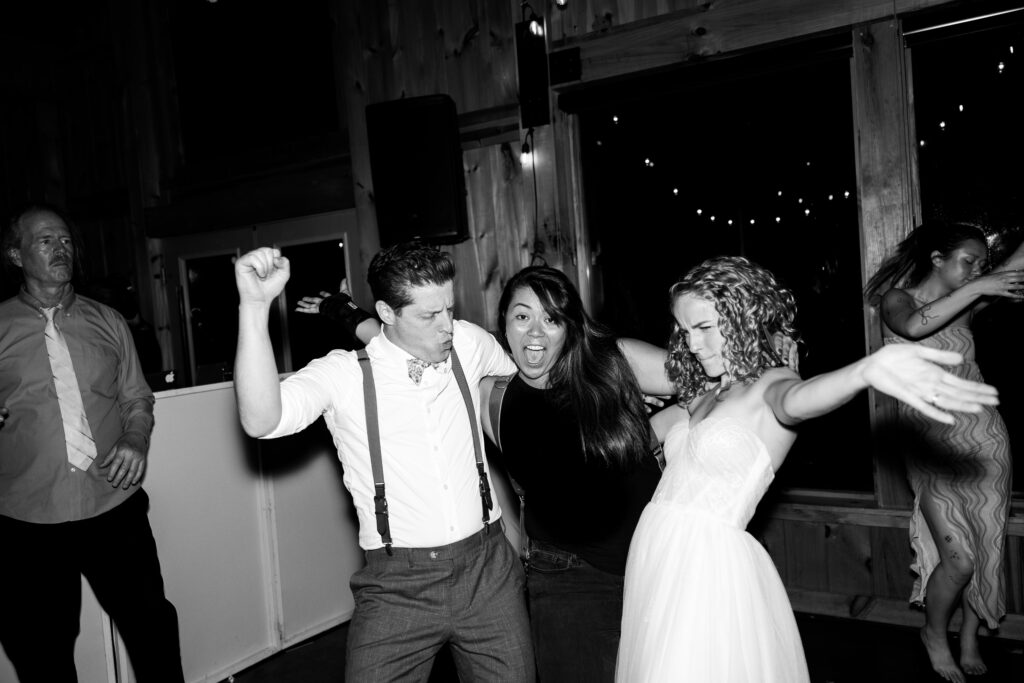 Wedding photographer Victoria V celebrating with couple after their ceremony
