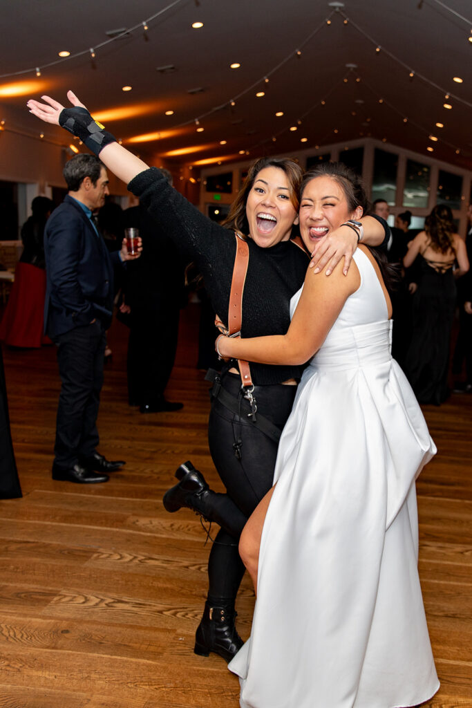 Wedding photographer enjoying a fun photo with her client during a Virginia wedding