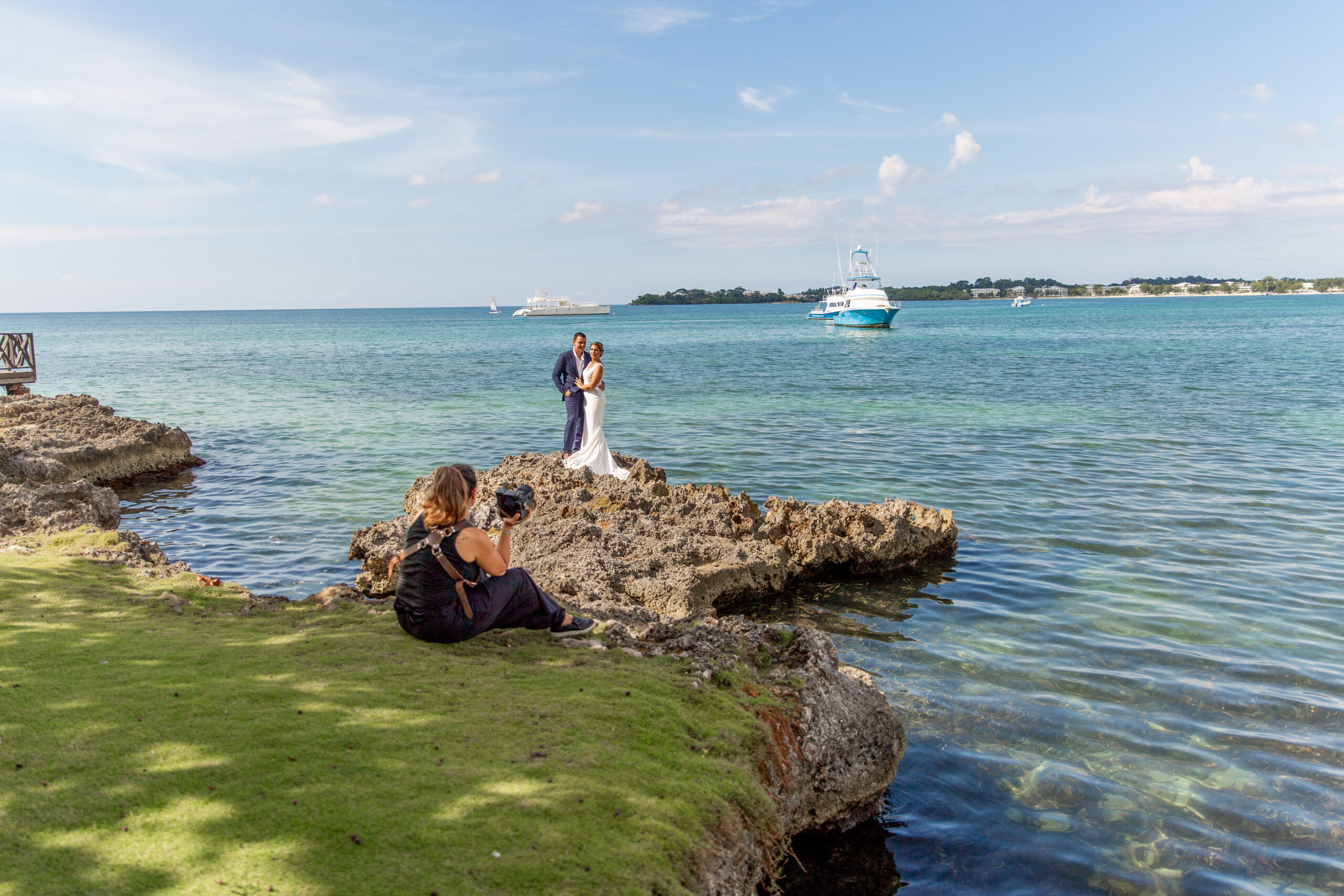 Questions to ask your wedding photographer - wedding photographer directing clients at destination wedding in Jamaica