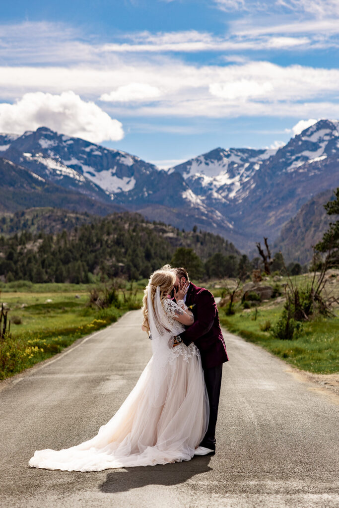 Bride and Groom kissing at Moraine Park, Rocky Mountain National Park, for an Colorado elopement with professional photos by a Colorado elopement photographer