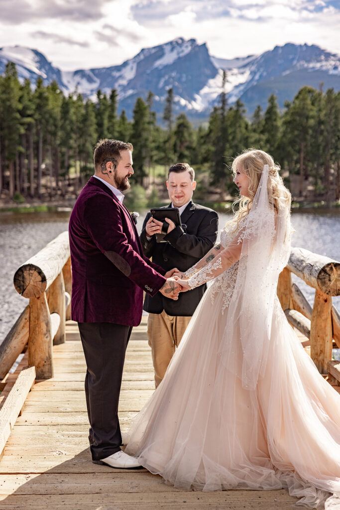 Professional photos by a Colorado elopement photographer of a Bride and groom during a Colorado elopement at Rocky Mountain National Park with elopement photography at Sprague Lake