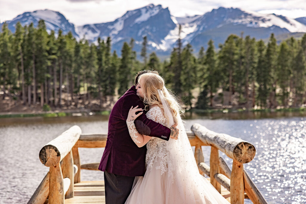 Professional photos by a Colorado elopement photographer of a Bride and groom during a Colorado elopement at Rocky Mountain National Park with elopement photography at Sprague Lake