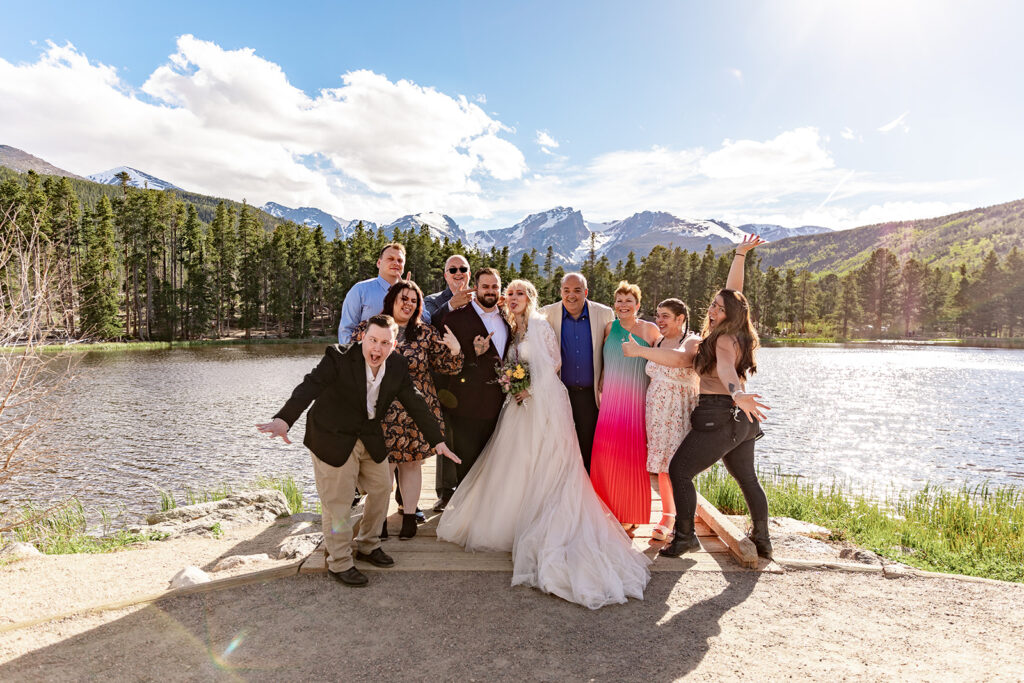 Professional photos by a Colorado elopement photographer of a Bride and groom during a Colorado elopement at Rocky Mountain National Park with elopement photography at Sprague Lake