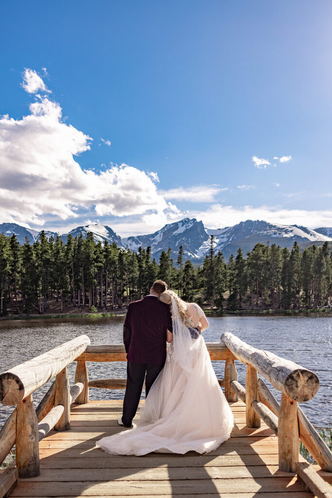 Professional photos by a Colorado elopement photographer of a Bride and groom during a Colorado elopement at Rocky Mountain National Park with elopement photography at Sprague Lake