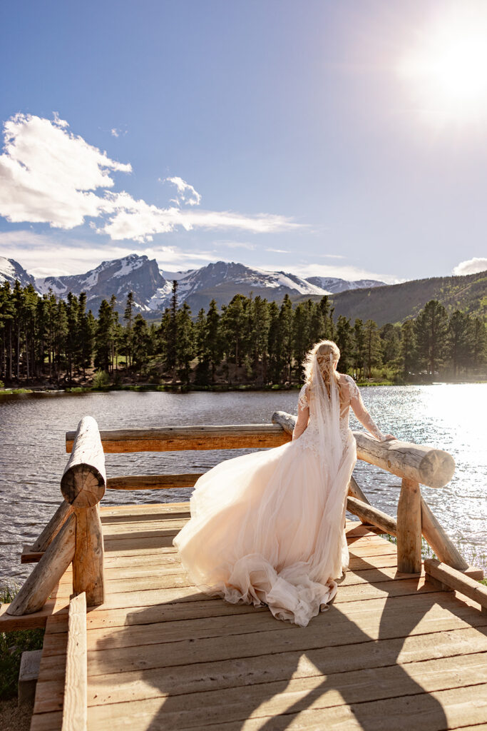 Professional photos by a Colorado elopement photographer of a Bride and groom during a Colorado elopement at Rocky Mountain National Park with elopement photography at Sprague Lake