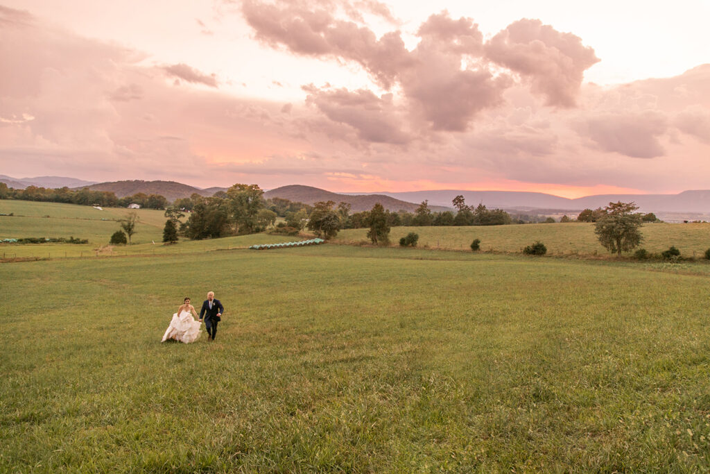 Bride and groom at a shenandoah wedding venue on their wedding day at sunset doing bridal sunset photos