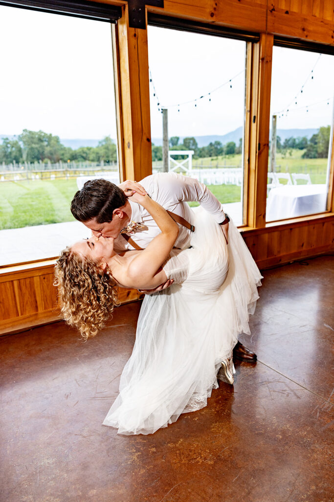 Bride and groom doing their first dance and enjoying their reception on their wedding day at a Shenandoah wedding venue Faithbrooke Farm and Vineyards