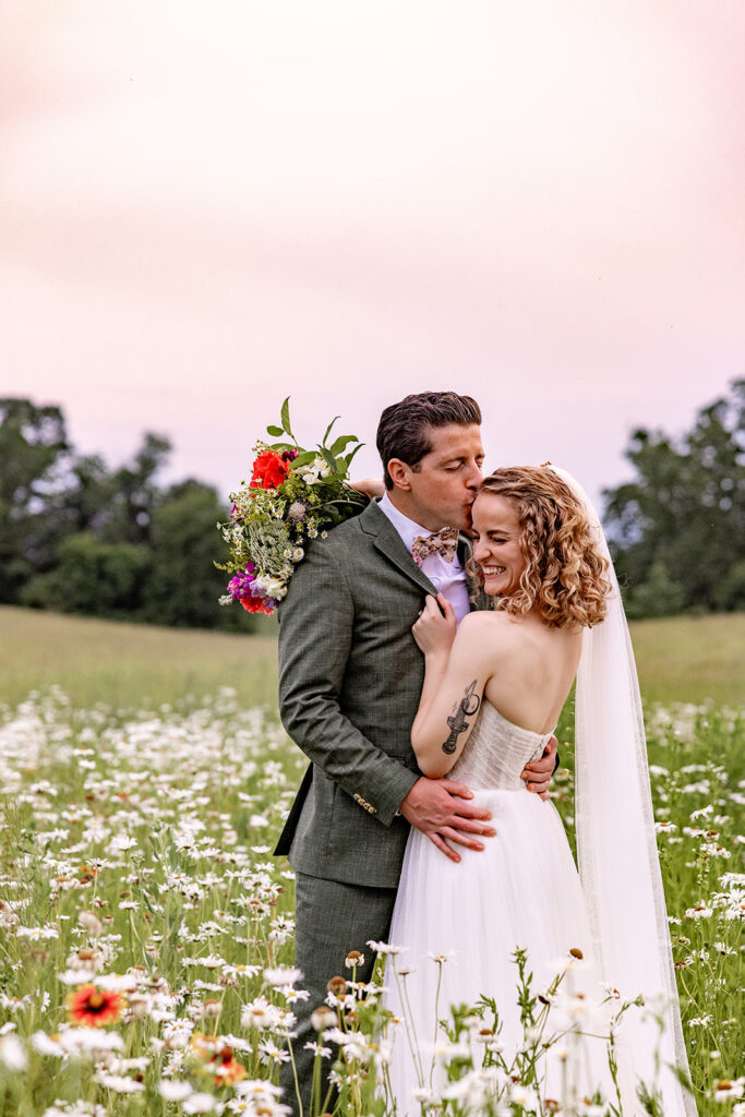 Bride and groom sunset portraits sunset photos on their wedding day at a Shenandoah wedding venue, faithbrooke farm and vineyards