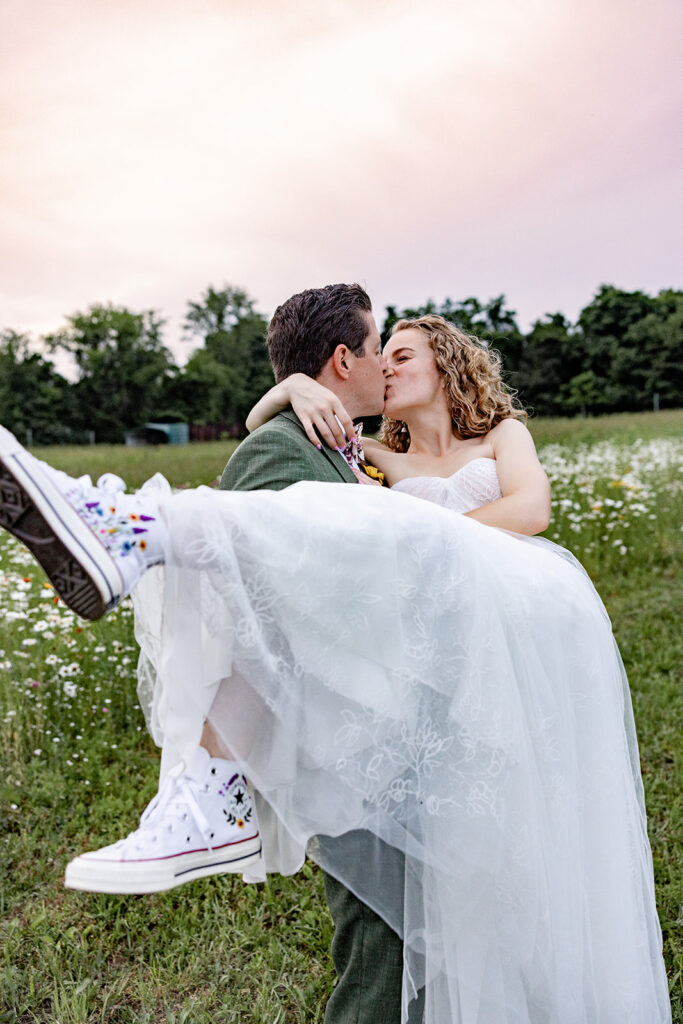 Bride and groom sunset portraits sunset photos on their wedding day at a Shenandoah wedding venue, faithbrooke farm and vineyards