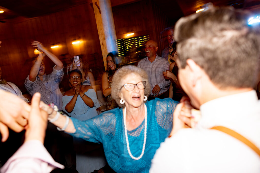 Bride and groom partying and enjoying their reception on their wedding day at a Shenandoah wedding venue Faithbrooke Farm and Vineyards