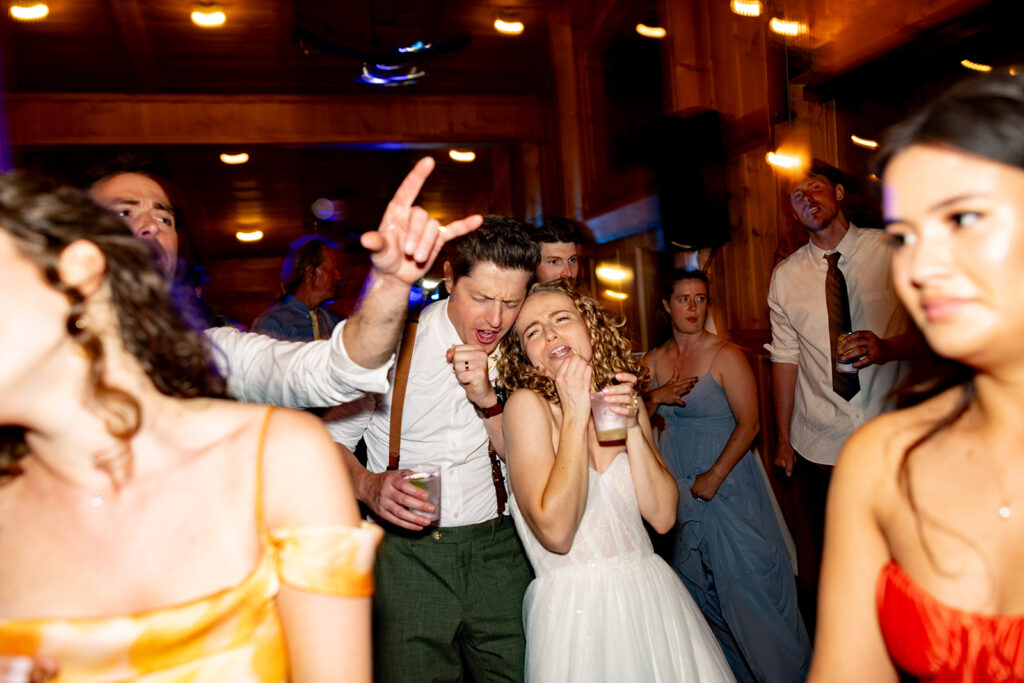 Bride and groom partying and enjoying their reception on their wedding day at a Shenandoah wedding venue Faithbrooke Farm and Vineyards