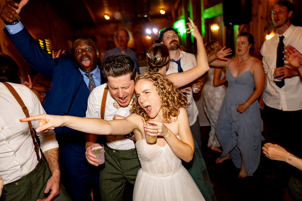 Bride and groom partying and enjoying their reception on their wedding day at a Shenandoah wedding venue Faithbrooke Farm and Vineyards