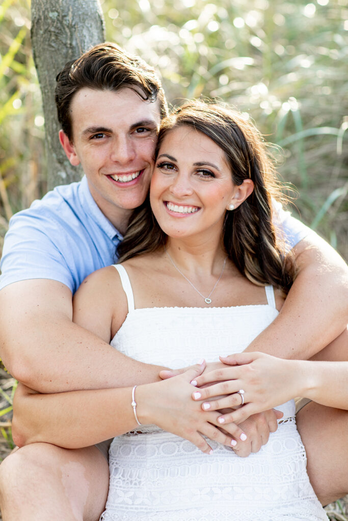 Bride and Groom pose for their Annapolis, md engagement session with Victoria V Photography the best wedding photographer in Annapolis. Annapolis engagement session. Beach engagement session. Best wedding photographer in the DMV. Destination wedding photographer. Virginia elopement photographer. Beach weddings. Beach engagements.