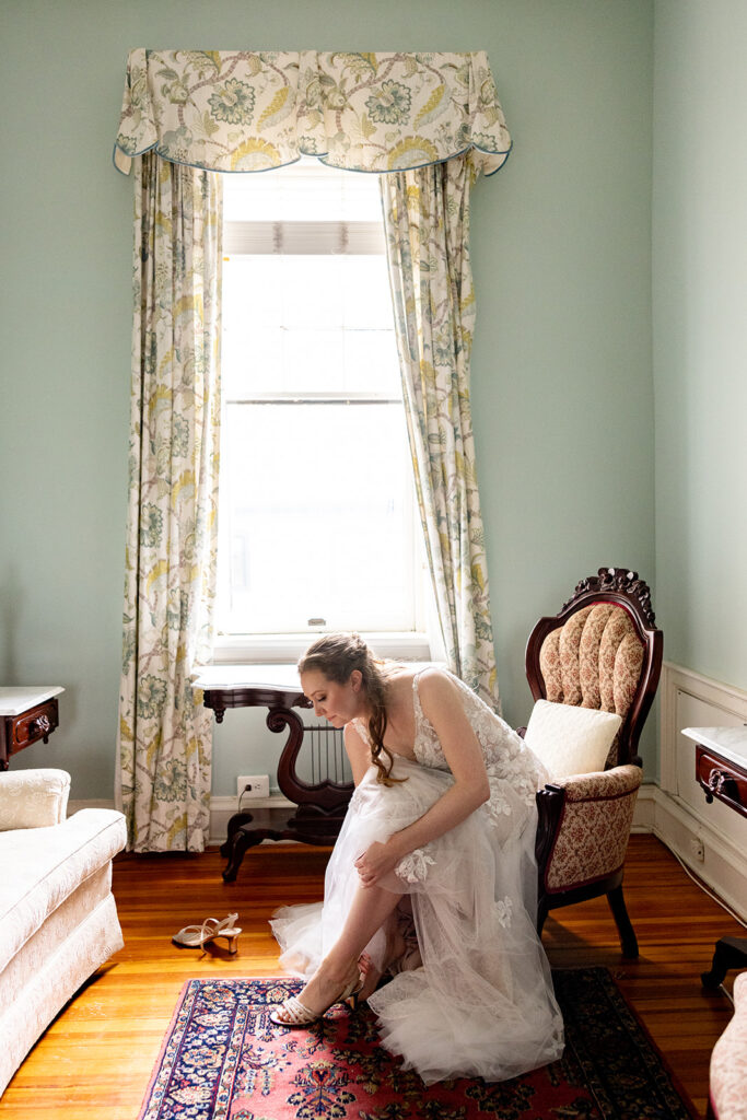 Bride getting ready for her wedding at The Ironclad Inn in downtown Fredericksburg, VA.