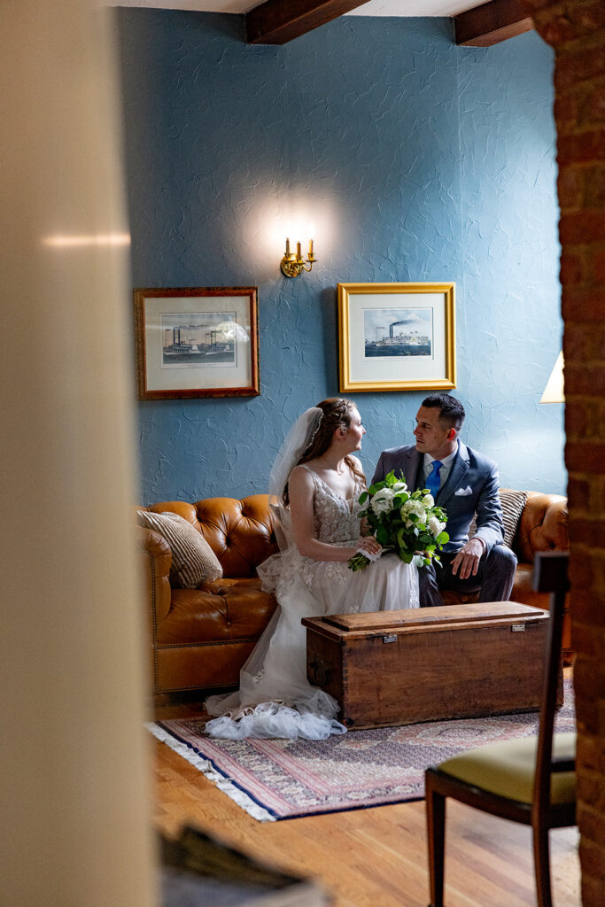 Romantic wedding portraits in downtown Fredericksburg, VA with a happy newlywed couple.