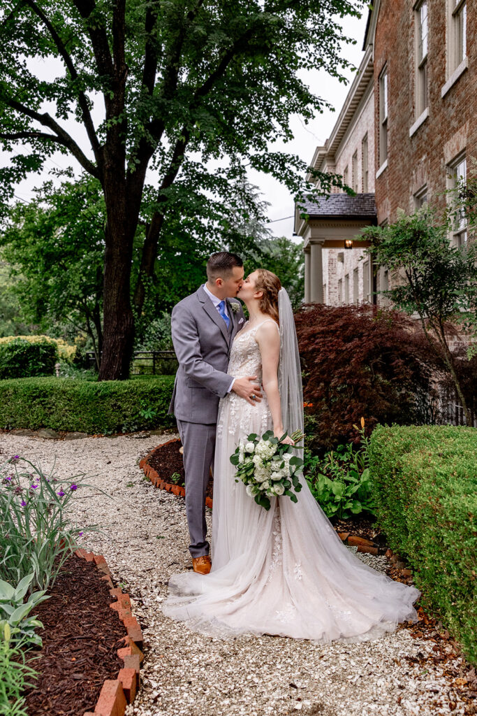 Romantic wedding portraits in downtown Fredericksburg, VA with a happy newlywed couple.