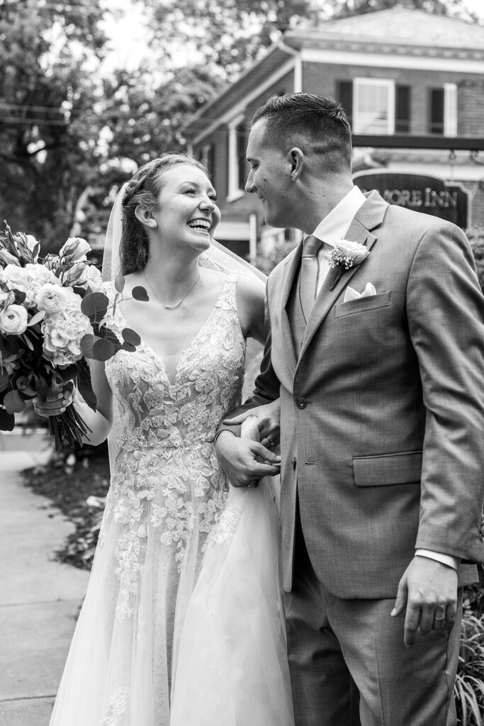 Romantic wedding portraits in downtown Fredericksburg, VA with a happy newlywed couple.