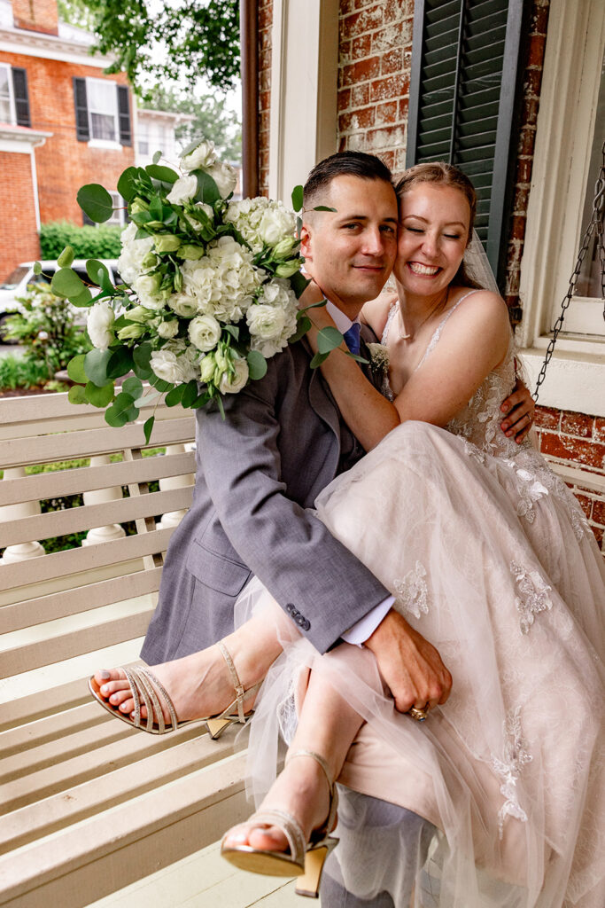 Romantic wedding portraits in downtown Fredericksburg, VA with a happy newlywed couple.