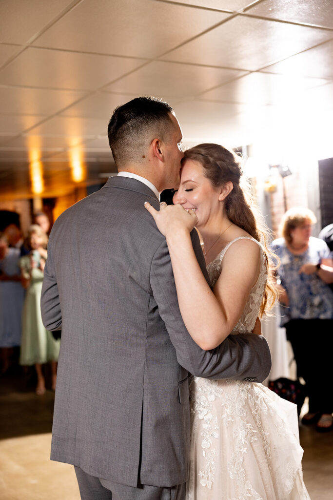 Romantic wedding portraits in downtown Fredericksburg, VA with a happy newlywed couple.