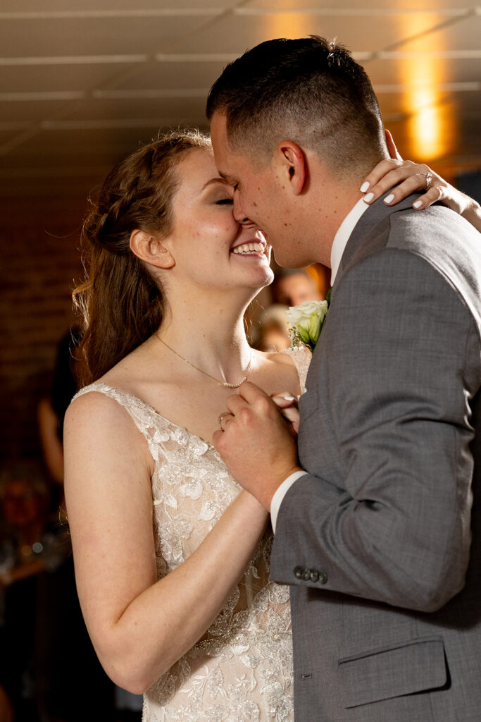 Romantic wedding portraits in downtown Fredericksburg, VA with a happy newlywed couple.