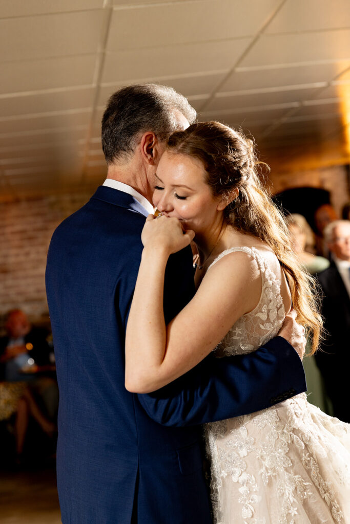 Romantic wedding portraits in downtown Fredericksburg, VA with a happy newlywed couple.