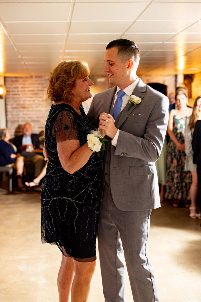 Romantic wedding portraits in downtown Fredericksburg, VA with a happy newlywed couple.