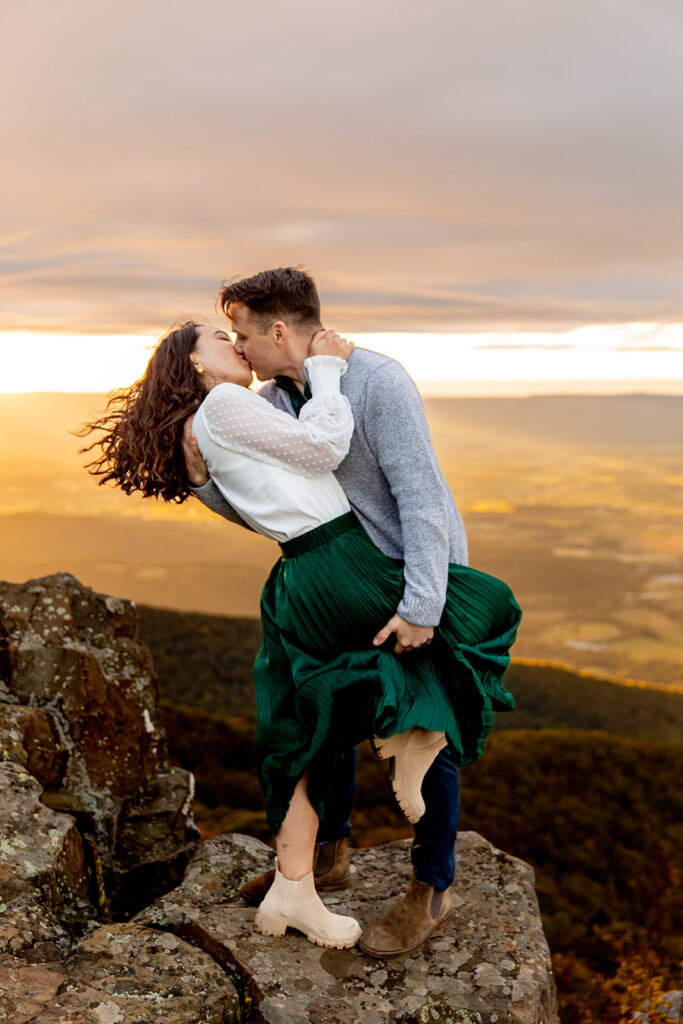 Bride and groom pose for engagement photos at golden hour in Shenandoah Valley with Victoria V Photography. Shenandoah wedding photographer. Shenandoah elopement photographer. Shenandoah sunset. Little Stony Man. Sunsets at Little Stony Man. Little Stony Man engagement session. Virginia elopement photographer.