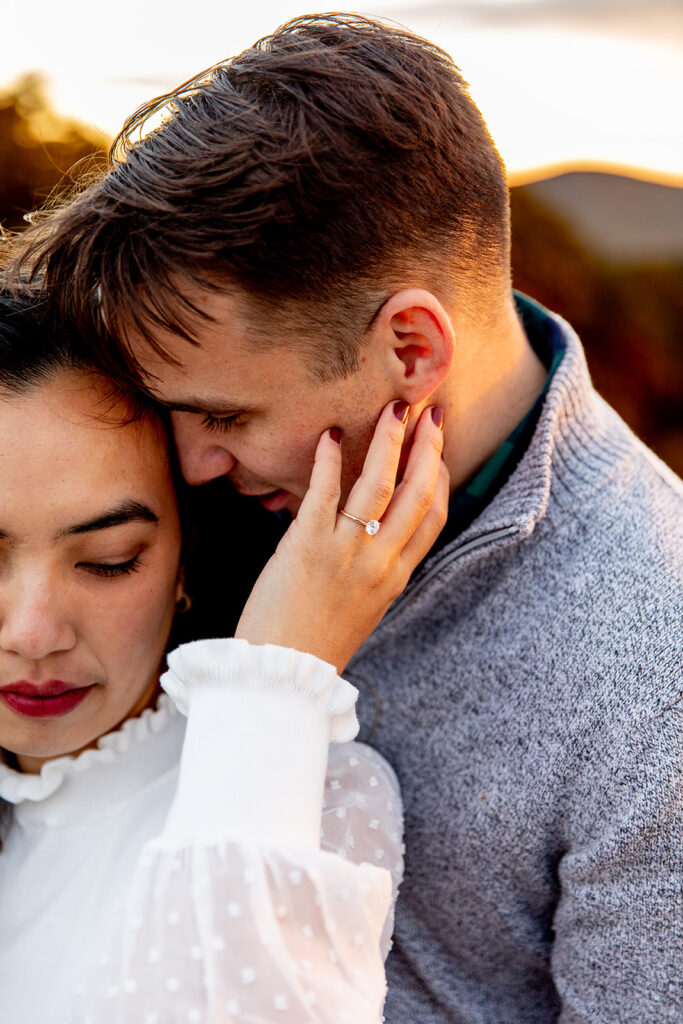 Bride and groom pose for engagement photos at golden hour in Shenandoah Valley with Victoria V Photography. Shenandoah wedding photographer. Shenandoah elopement photographer. Shenandoah sunset. Little Stony Man. Sunsets at Little Stony Man. Little Stony Man engagement session. Virginia elopement photographer.