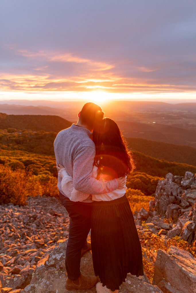 Bride and groom pose for engagement photos at golden hour in Shenandoah Valley with Victoria V Photography. Shenandoah wedding photographer. Shenandoah elopement photographer. Shenandoah sunset. Little Stony Man. Sunsets at Little Stony Man. Little Stony Man engagement session. Virginia elopement photographer.