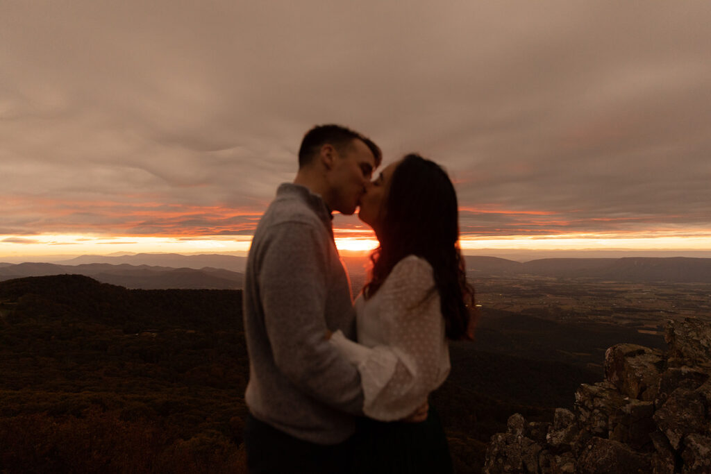 Bride and groom pose for engagement photos at golden hour in Shenandoah Valley with Victoria V Photography. Shenandoah wedding photographer. Shenandoah elopement photographer. Shenandoah sunset. Little Stony Man. Sunsets at Little Stony Man. Little Stony Man engagement session. Virginia elopement photographer.