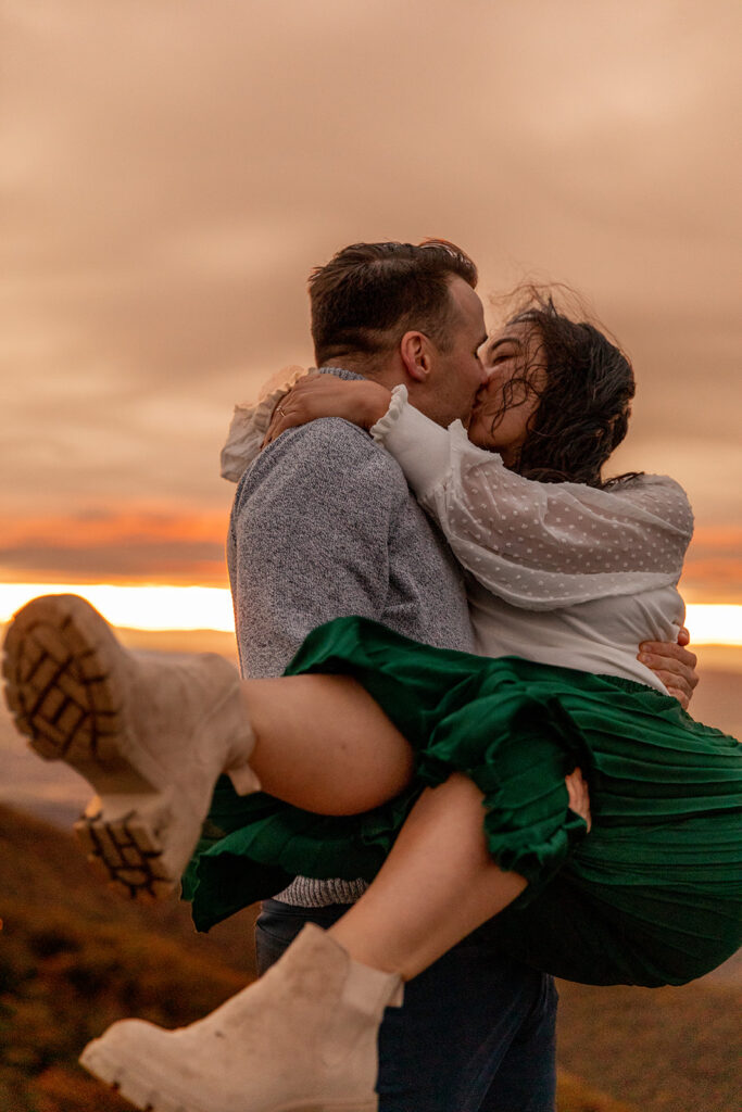 Bride and groom pose for engagement photos at golden hour in Shenandoah Valley with Victoria V Photography. Shenandoah wedding photographer. Shenandoah elopement photographer. Shenandoah sunset. Little Stony Man. Sunsets at Little Stony Man. Little Stony Man engagement session. Virginia elopement photographer.