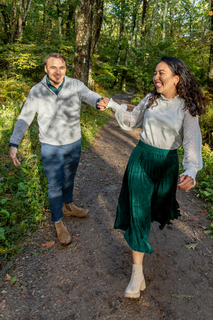 Bride and groom pose for engagement photos at golden hour in Shenandoah Valley with Victoria V Photography. Shenandoah wedding photographer. Shenandoah elopement photographer. Shenandoah sunset. Little Stony Man. Sunsets at Little Stony Man. Little Stony Man engagement session. Virginia elopement photographer.