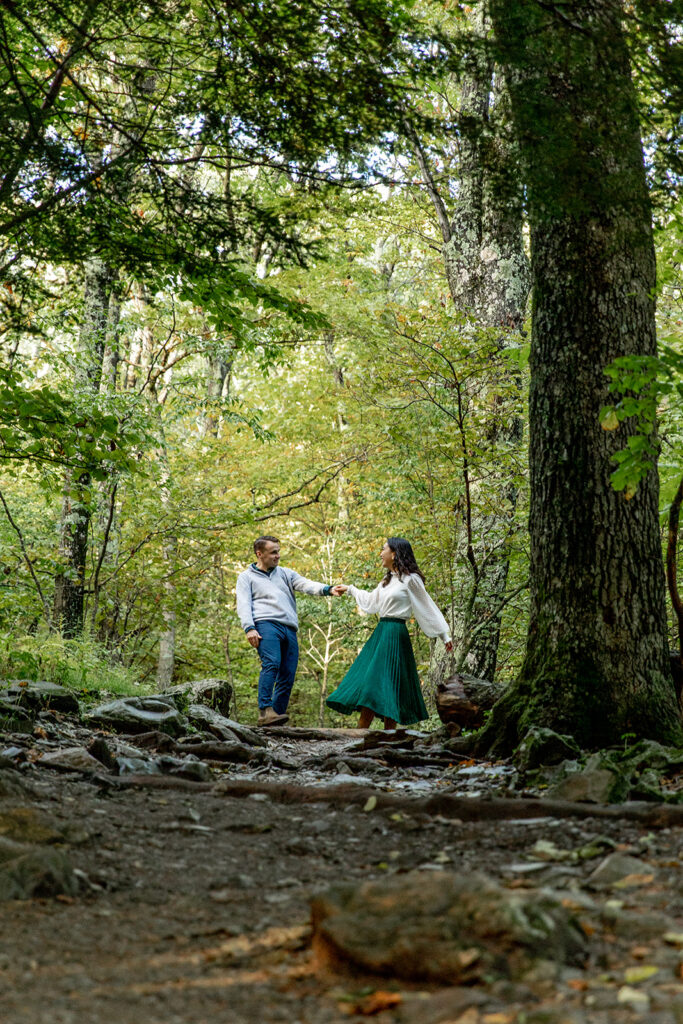 Bride and groom pose for engagement photos at golden hour in Shenandoah Valley with Victoria V Photography. Shenandoah wedding photographer. Shenandoah elopement photographer. Shenandoah sunset. Little Stony Man. Sunsets at Little Stony Man. Little Stony Man engagement session. Virginia elopement photographer.