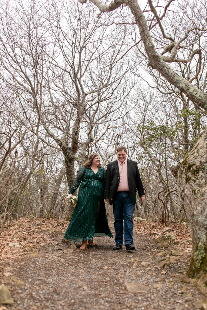 Bride and groom laughing on their walk up to their elopement at Little Stoneyman