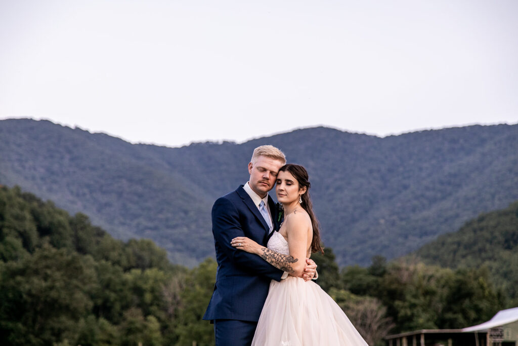 Bride and groom at their elegant Blue Ridge Mountain wedding at Stoneyman Valley Ranch – romantic sunset portraits, adventurous love, and breathtaking views.