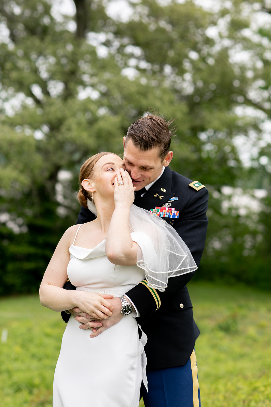 Bride whispers to groom in intimate candid shot post intimate wedding ceremony at River Farm in Alexandria ,Virginia