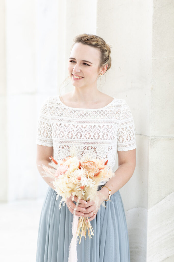 Romantic couple’s wedding photos in front of the Lincoln Memorial’s grand columns for DC elopement