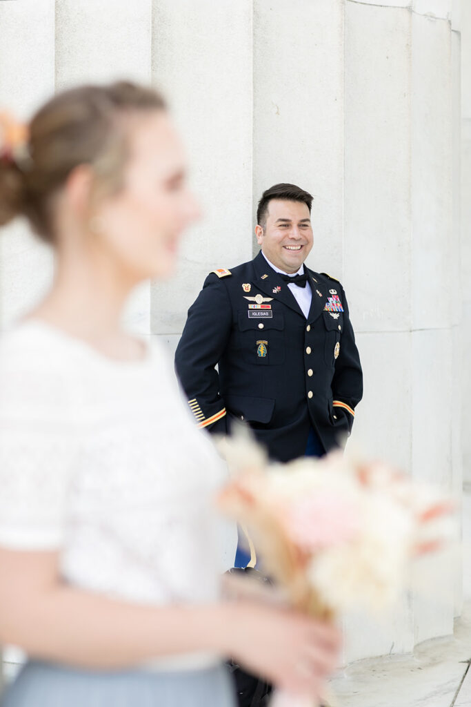 Romantic couple’s wedding photos in front of the Lincoln Memorial’s grand columns for DC elopement