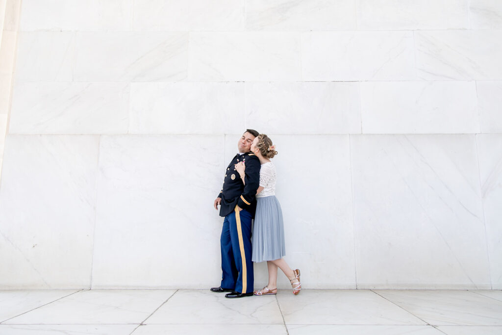 Romantic couple’s wedding photos in front of the Lincoln Memorial’s grand columns for DC elopement