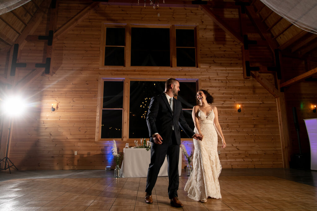 Elegant and adventurous mountain wedding at Stoneyman Valley Ranch – bride and groom portraits with Blue Ridge Mountain views, joyful first look, fun bridal party moments, and stunning sunset photos atop Little Stoneyman Overlook.