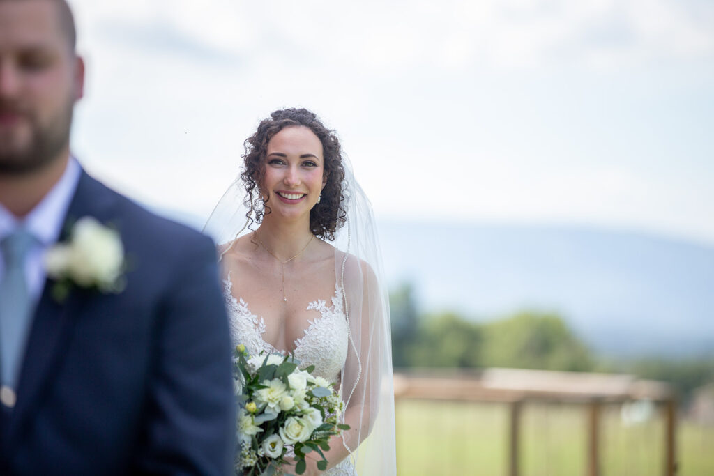 Elegant and adventurous mountain wedding at Stoneyman Valley Ranch – bride and groom portraits with Blue Ridge Mountain views, joyful first look, fun bridal party moments, and stunning sunset photos atop Little Stoneyman Overlook.