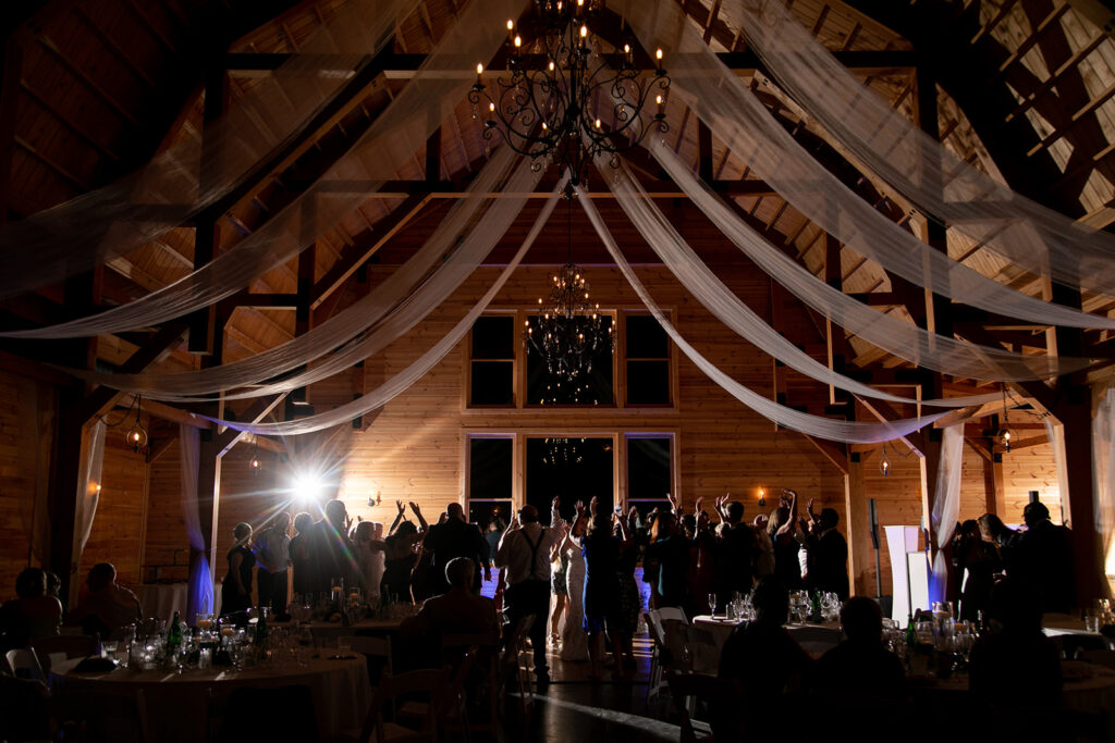 Elegant and adventurous mountain wedding at Stoneyman Valley Ranch – bride and groom portraits with Blue Ridge Mountain views, joyful first look, fun bridal party moments, and stunning sunset photos atop Little Stoneyman Overlook.