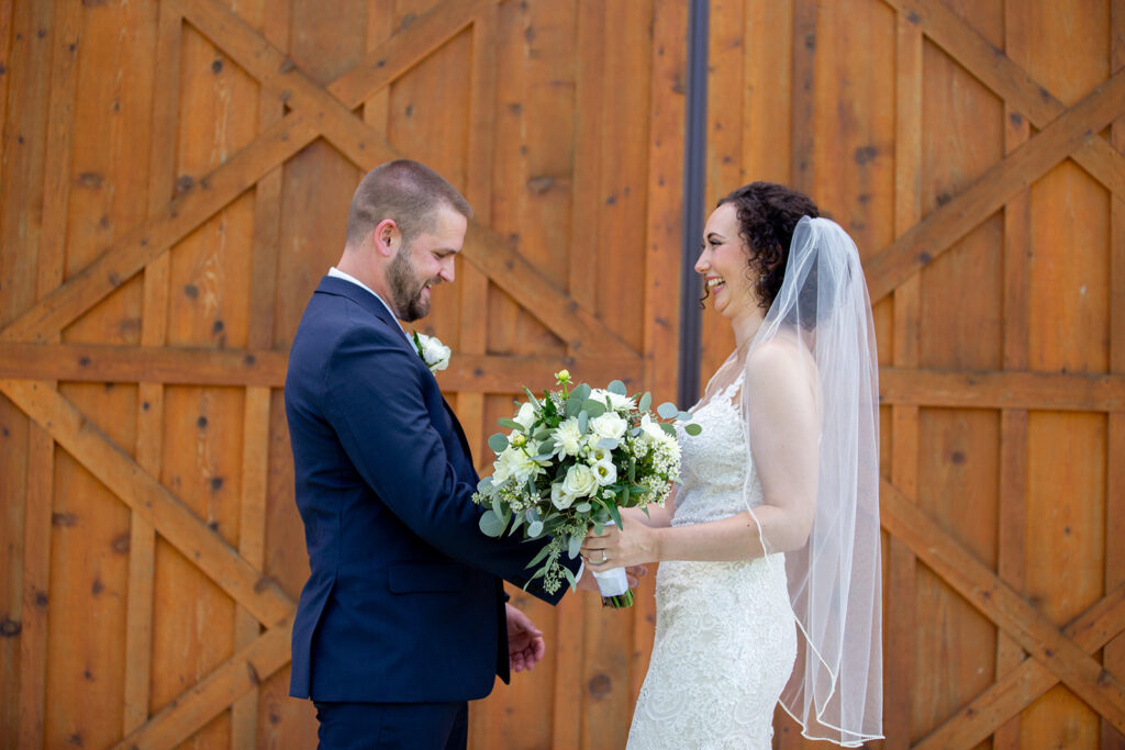 Elegant and adventurous mountain wedding at Stoneyman Valley Ranch – bride and groom portraits with Blue Ridge Mountain views, joyful first look, fun bridal party moments, and stunning sunset photos atop Little Stoneyman Overlook.