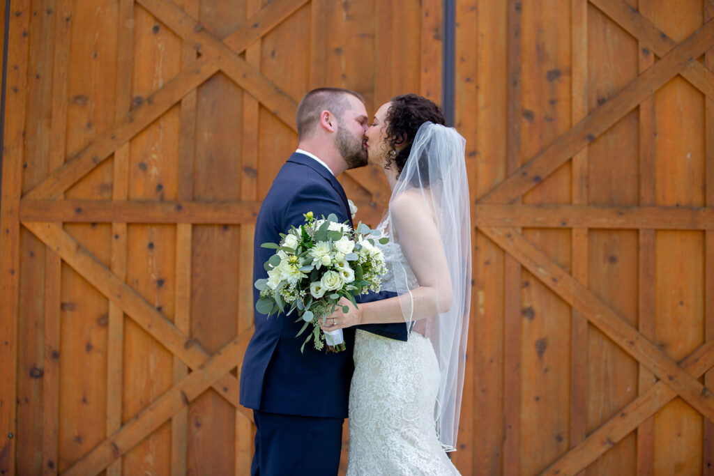 Elegant and adventurous mountain wedding at Stoneyman Valley Ranch – bride and groom portraits with Blue Ridge Mountain views, joyful first look, fun bridal party moments, and stunning sunset photos atop Little Stoneyman Overlook.