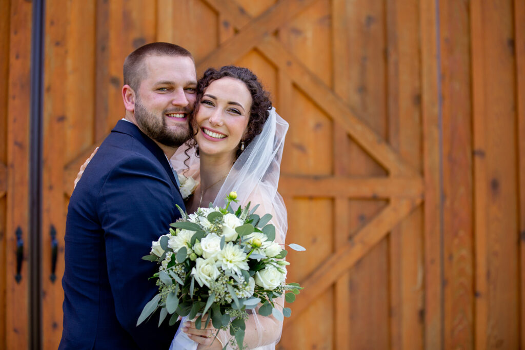 Elegant and adventurous mountain wedding at Stoneyman Valley Ranch – bride and groom portraits with Blue Ridge Mountain views, joyful first look, fun bridal party moments, and stunning sunset photos atop Little Stoneyman Overlook.