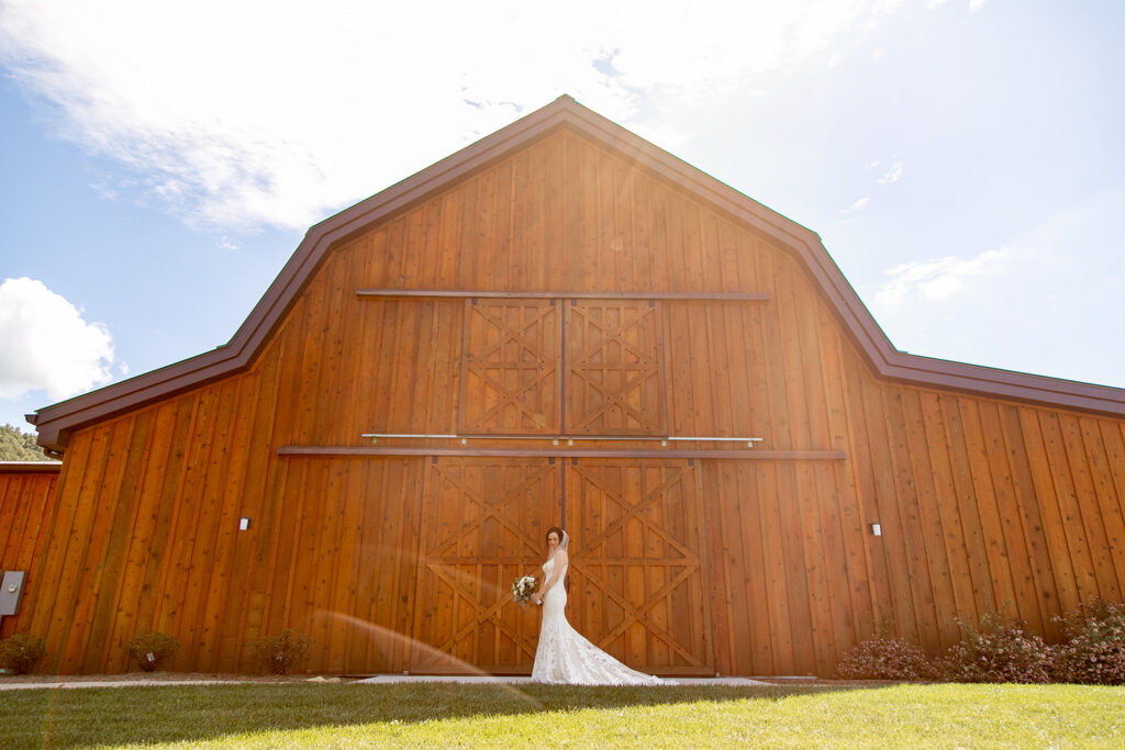 Elegant and adventurous mountain wedding at Stoneyman Valley Ranch – bride and groom portraits with Blue Ridge Mountain views, joyful first look, fun bridal party moments, and stunning sunset photos atop Little Stoneyman Overlook.