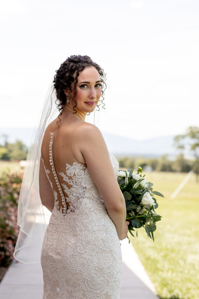 Elegant and adventurous mountain wedding at Stoneyman Valley Ranch – bride and groom portraits with Blue Ridge Mountain views, joyful first look, fun bridal party moments, and stunning sunset photos atop Little Stoneyman Overlook.