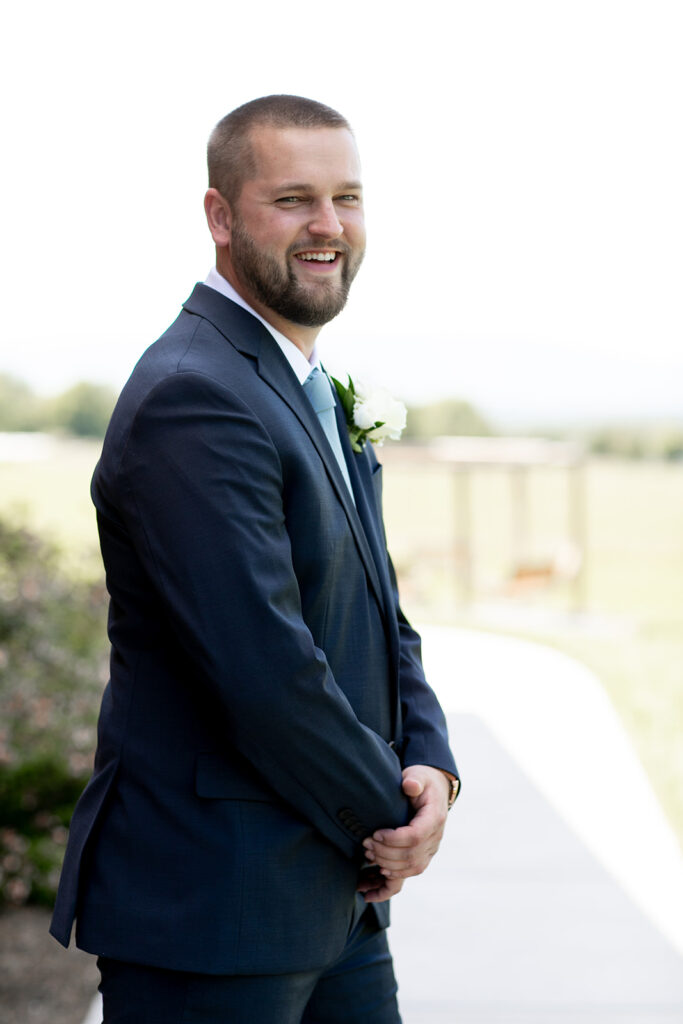 Elegant and adventurous mountain wedding at Stoneyman Valley Ranch – bride and groom portraits with Blue Ridge Mountain views, joyful first look, fun bridal party moments, and stunning sunset photos atop Little Stoneyman Overlook.